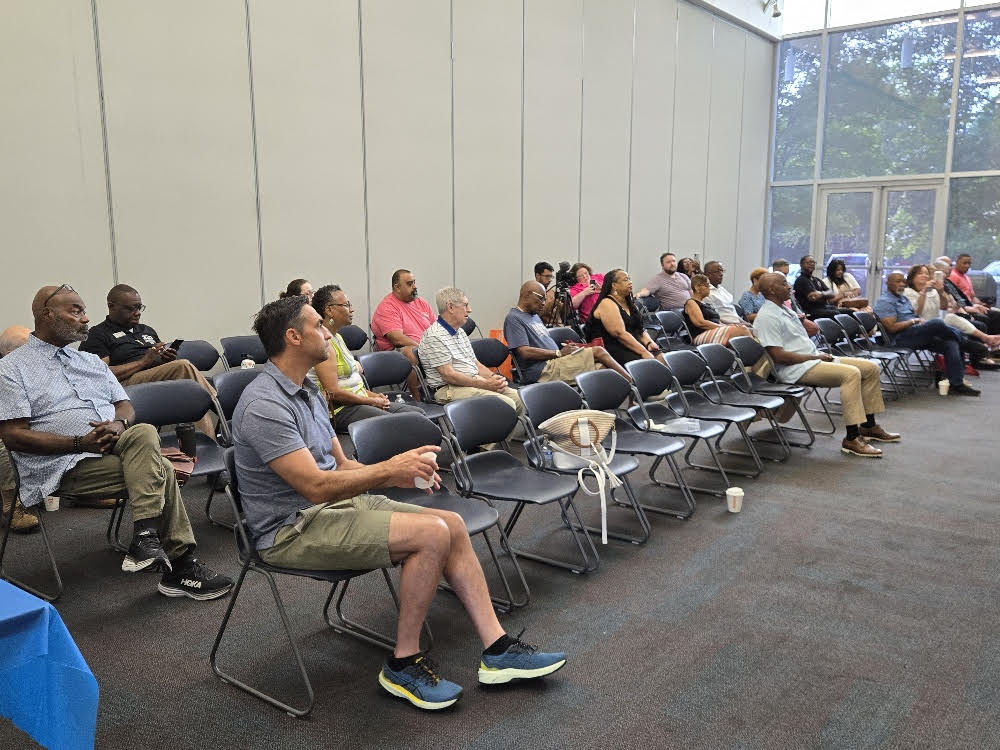 The crowd listens to Michelle Kang